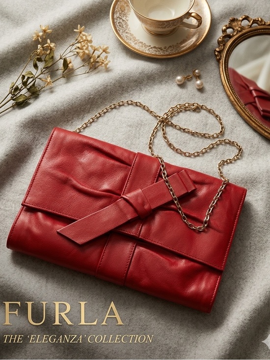 Furla Handbags - Beautiful Red Furla Bow
Clutch w/removable gold chain calfskin leather VTG